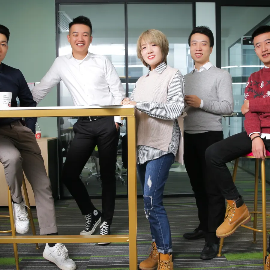 Shinetech China-based software development team in an office group portrait