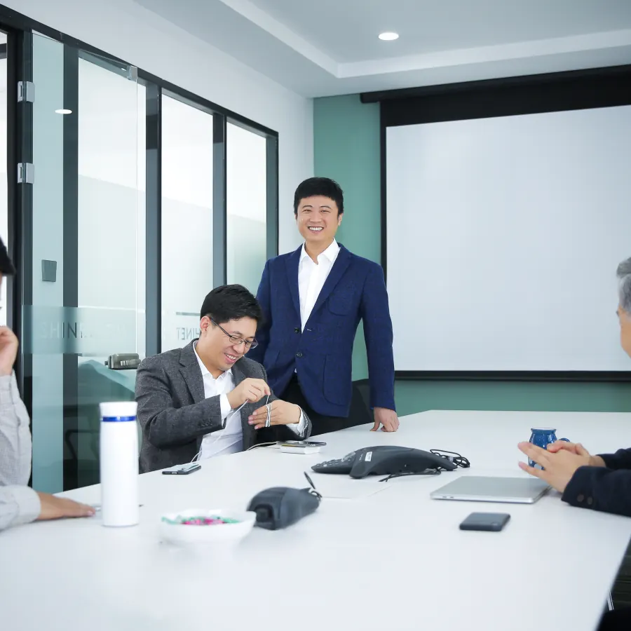 Shinetech team discussing project requirements in a meeting room