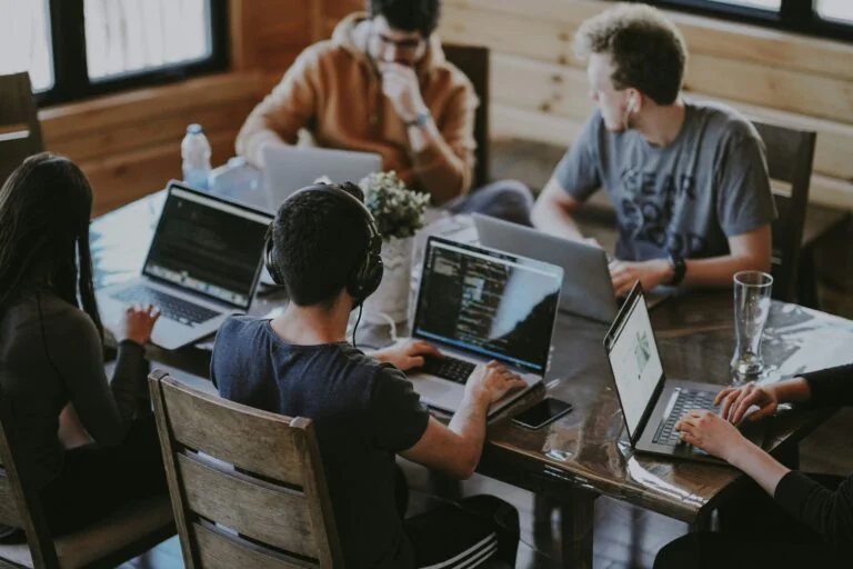 Software professionals collaborating as demand for developers grows